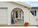 Front entrance with a door that has glass panes at 928 Spindle Palm Way, Apollo Beach, FL 33572