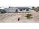 A one-story white stucco home with an attached garage with potential for lush landscaping at 928 Spindle Palm Way, Apollo Beach, FL 33572