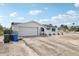 Charming, one-story home with white stucco exterior, attached garage, and potential for a beautifully landscaped yard at 928 Spindle Palm Way, Apollo Beach, FL 33572