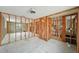 Interior view of a room with framing and cinder block walls, showcasing potential bathroom area at 928 Spindle Palm Way, Apollo Beach, FL 33572