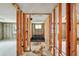 Hallway in an unfinished home, framing for walls and plumbing visible throughout the room at 928 Spindle Palm Way, Apollo Beach, FL 33572