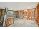 Spacious room featuring exposed framework, concrete block walls, and windows, ready for renovation and personalization at 928 Spindle Palm Way, Apollo Beach, FL 33572