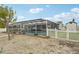 Backyard featuring a screened-in pool enclosure offering a private retreat for relaxation and enjoyment at 928 Spindle Palm Way, Apollo Beach, FL 33572