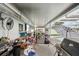 Covered patio with an outdoor seating area next to the screened-in pool at 928 Spindle Palm Way, Apollo Beach, FL 33572