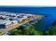 Waterfront property featuring the water in the background, a pool, and a boat dock at 10315 Cortez W Rd # 38Bv, Bradenton, FL 34210