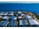 Aerial view of waterfront homes showcasing the property's location with a large body of water nearby at 10315 Cortez W Rd # 38Bv, Bradenton, FL 34210