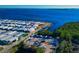 Aerial view of the community with waterfront homes, boat docks, and a nearby canal at 10315 Cortez W Rd # 38Bv, Bradenton, FL 34210