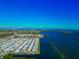 Sweeping aerial view of homes nestled along the waterfront with beautiful blue ocean views at 10315 Cortez W Rd # 38Bv, Bradenton, FL 34210