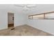 Neutral bedroom featuring tile flooring, a ceiling fan and wood-look blinds at 10315 Cortez W Rd # 38Bv, Bradenton, FL 34210