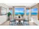 Dining room features a round table and chairs and large window views of the water at 10315 Cortez W Rd # 38Bv, Bradenton, FL 34210