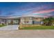 Charming home with a covered parking, landscaped lawn, and delightful curb appeal at 10315 Cortez W Rd # 38Bv, Bradenton, FL 34210