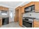 Well-equipped kitchen featuring stainless steel appliances, granite countertops, and ample cabinet space at 10315 Cortez W Rd # 38Bv, Bradenton, FL 34210