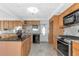 Kitchen featuring an island, stainless steel appliances and stone backsplash at 10315 Cortez W Rd # 38Bv, Bradenton, FL 34210