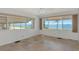 Light-filled living room featuring tiled floors and waterfront views at 10315 Cortez W Rd # 38Bv, Bradenton, FL 34210