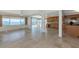 Open living space with tile flooring offering views of the water and access to the kitchen at 10315 Cortez W Rd # 38Bv, Bradenton, FL 34210