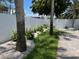 The backyard shows a peaceful garden and brick walkway to the gate at 106 N Blvd Of The Presidents, Sarasota, FL 34236