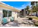 Outdoor patio area with a screened-in pool and a paved patio with chairs, perfect for relaxing at 106 N Blvd Of The Presidents, Sarasota, FL 34236