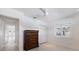 Bright bedroom featuring a ceiling fan, closet, and wood dresser at 106 N Blvd Of The Presidents, Sarasota, FL 34236