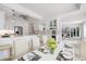 Bright and airy dining area open to a gourmet kitchen featuring a large island and stainless steel appliances at 106 N Blvd Of The Presidents, Sarasota, FL 34236