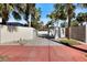 Long driveway lined by walls and palms, leading to the home and enhancing curb appeal at 106 N Blvd Of The Presidents, Sarasota, FL 34236