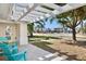 View from front porch showing pergola, seating, and view of street at 106 N Blvd Of The Presidents, Sarasota, FL 34236