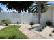 Charming front yard with a white picket fence, lush green lawn, and a brick walkway at 106 N Blvd Of The Presidents, Sarasota, FL 34236