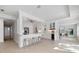 Bright and modern kitchen with stainless steel appliances, quartz countertops, and a stylish breakfast bar at 106 N Blvd Of The Presidents, Sarasota, FL 34236