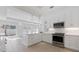 Bright kitchen with white cabinetry, stainless steel appliances, and an island at 106 N Blvd Of The Presidents, Sarasota, FL 34236
