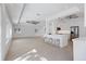 Spacious kitchen with an open layout, stainless steel appliances, an island with seating, and tile floors at 106 N Blvd Of The Presidents, Sarasota, FL 34236