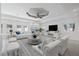 Inviting living room featuring a unique ceiling design and plenty of comfortable seating at 106 N Blvd Of The Presidents, Sarasota, FL 34236