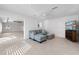 Comfortable living room with pool view, tile floors, and a couch with ottomans at 106 N Blvd Of The Presidents, Sarasota, FL 34236