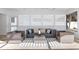 Bright sunroom area with modern furnishings and multiple windows offering serene views at 106 N Blvd Of The Presidents, Sarasota, FL 34236