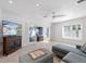 Bright living room with tile flooring, pool view, and cozy seating, perfect for relaxing and entertaining at 106 N Blvd Of The Presidents, Sarasota, FL 34236