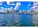 Beautiful waterfront with luxury yachts and city buildings under a bright sky at 106 N Blvd Of The Presidents, Sarasota, FL 34236