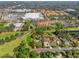 Aerial view of property with defined boundary, nestled among mature trees and lush landscaping in a vibrant neighborhood at 109 Burney Rd, Osprey, FL 34229