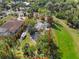 Aerial view of property with defined boundary, showcasing its location amidst mature trees and lush green space at 109 Burney Rd, Osprey, FL 34229