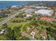 Aerial view showcasing the property's location near the water and retail area at 109 Burney Rd, Osprey, FL 34229