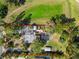 Overhead aerial view of the property with a defined boundary, highlighting the spacious layout and lush landscaping at 109 Burney Rd, Osprey, FL 34229