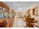 Inviting dining area with wooden furniture, tile flooring, and ample natural light at 109 Burney Rd, Osprey, FL 34229