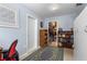 Office with light blue walls, a desk, and a walk-in closet featuring extensive shelving at 109 Burney Rd, Osprey, FL 34229