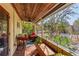 View of a screened-in porch with a ceiling fan and view of the backyard at 109 Burney Rd, Osprey, FL 34229