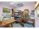 Organized studio features abundant shelving, storage, and natural light ideal for hobbies and crafts at 109 Burney Rd, Osprey, FL 34229