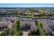 Aerial view of a luxury home on the water with a private pool, screened lanai and boat dock at 11739 River Shores Trl, Parrish, FL 34219