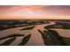 Breathtaking aerial view of a winding river and lush landscape at sunset at 11739 River Shores Trl, Parrish, FL 34219
