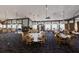 Spacious banquet hall featuring a large stone fireplace and abundant natural light at 11739 River Shores Trl, Parrish, FL 34219