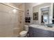 Elegant bathroom featuring granite countertops, a glass enclosed shower, and modern fixtures at 11739 River Shores Trl, Parrish, FL 34219