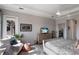 Comfortable bedroom featuring a cozy seating area, dresser with TV, and serene decor for a relaxing atmosphere at 11739 River Shores Trl, Parrish, FL 34219