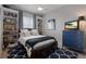Cozy bedroom featuring built-in shelving, a ceiling fan, and a vibrant blue dresser at 11739 River Shores Trl, Parrish, FL 34219