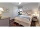 Charming bedroom with a white rattan bed, soft lighting, and cheerful decor creating a cozy and inviting space at 11739 River Shores Trl, Parrish, FL 34219