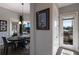 Dining area with modern lighting and view to covered patio at 11739 River Shores Trl, Parrish, FL 34219